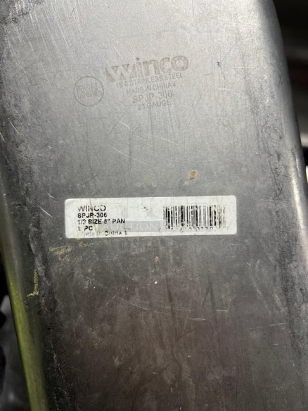 Winco stainless steel 1/3-size hotel pan, model SPJP-306, 6" deep. Visible markings include model and size details.