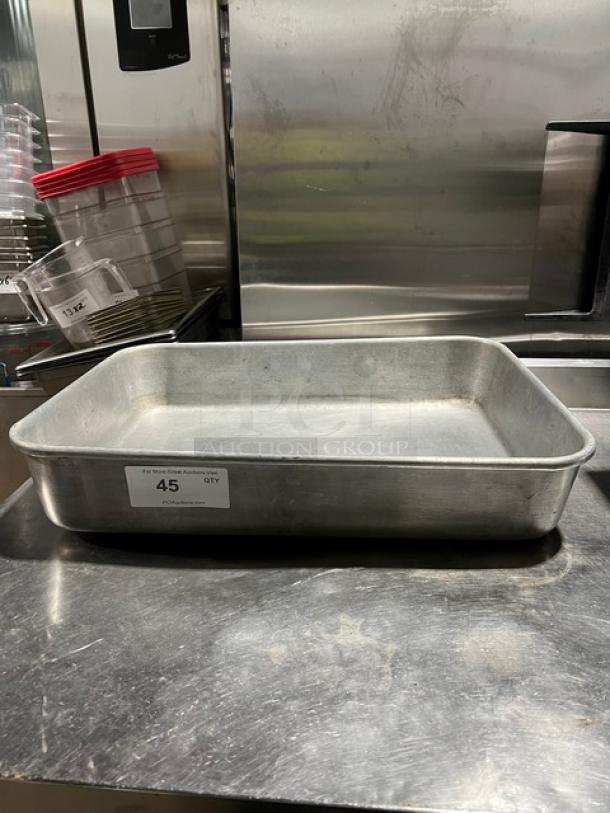 Commercial rectangular roasting pan with handles, metal, used condition. Features a label marked "45 QTY." Ideal for large batches.