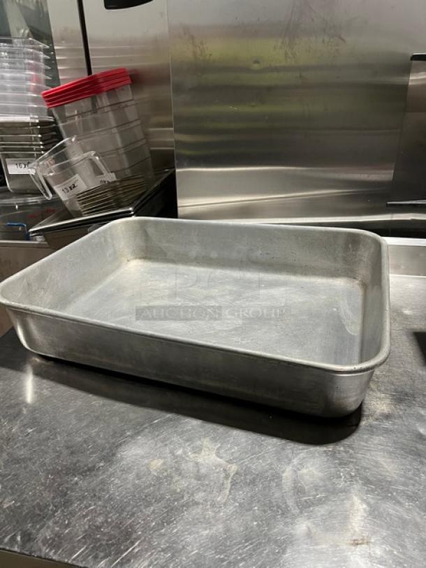 Commercial rectangular roasting pan with handles, metal finish, used condition. Ideal for large-scale cooking.