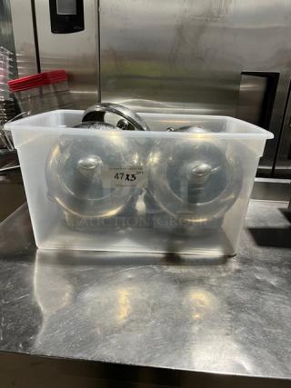 Commercial round braiser pans with dome style lids in clear bin. Label indicates 47 units, 5X quantity listed. Stainless steel.