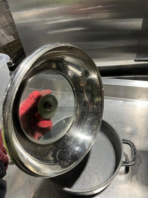 Commercial round braiser pan with dome-style lid, stainless steel, used condition, suitable for professional kitchens.