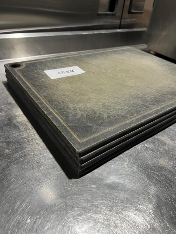 Commercial rectangular cutting boards, set of four, with a textured surface and slight wear, labeled "48Xu."
