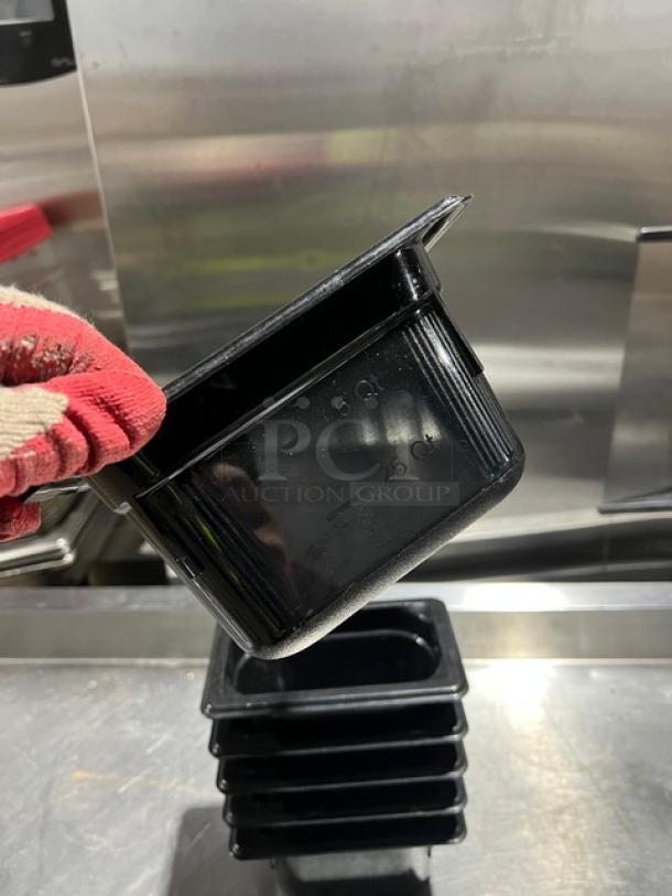 Vollrath Super Pan 3 Series, model 90944, black 1/9-size, 4" deep food pan, commercial grade, stacked view.