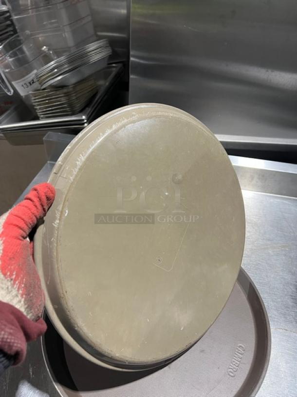 Cambro commercial brown round serving tray, used condition, visible logo, durable plastic material, ideal for fast food service.