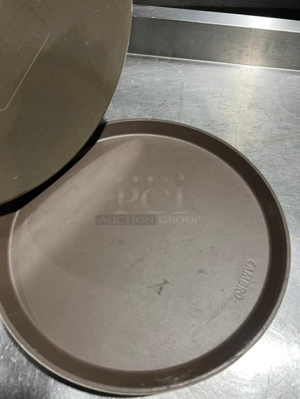 Cambro commercial brown round serving tray, lightly used. Features embossed logo. Ideal for fast food service.