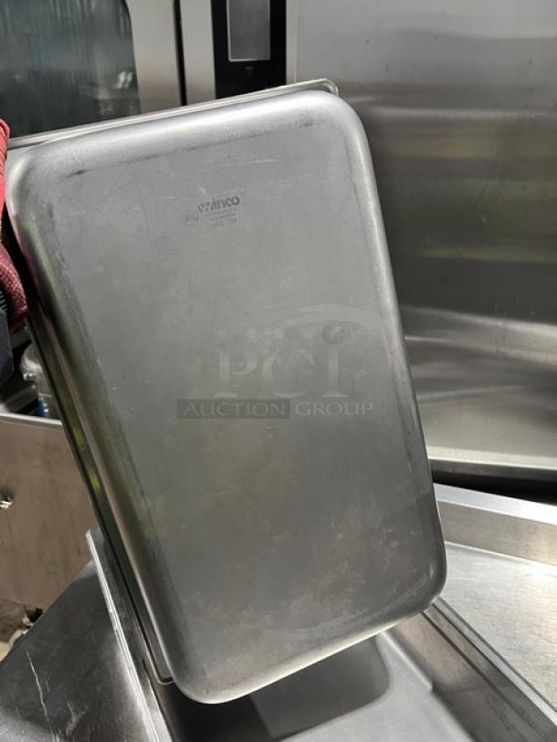 Winco SPJL104 stainless steel full-size 4" deep anti-jam hotel pan. Used, good condition. Model marking visible.