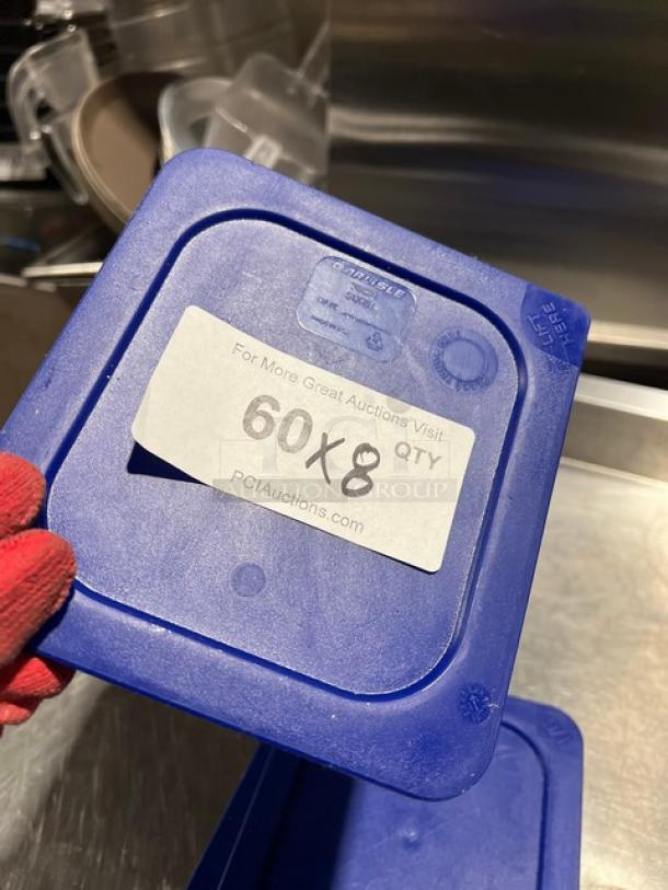 Carlisle 30582 blue square food storage container lid, commercial-grade, 1/6-size, visible label for auction details.