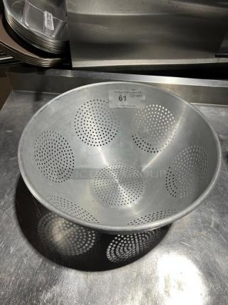 Commercial aluminum colander with round geometric pattern, excellent condition. Label with number 61 indicates lot.