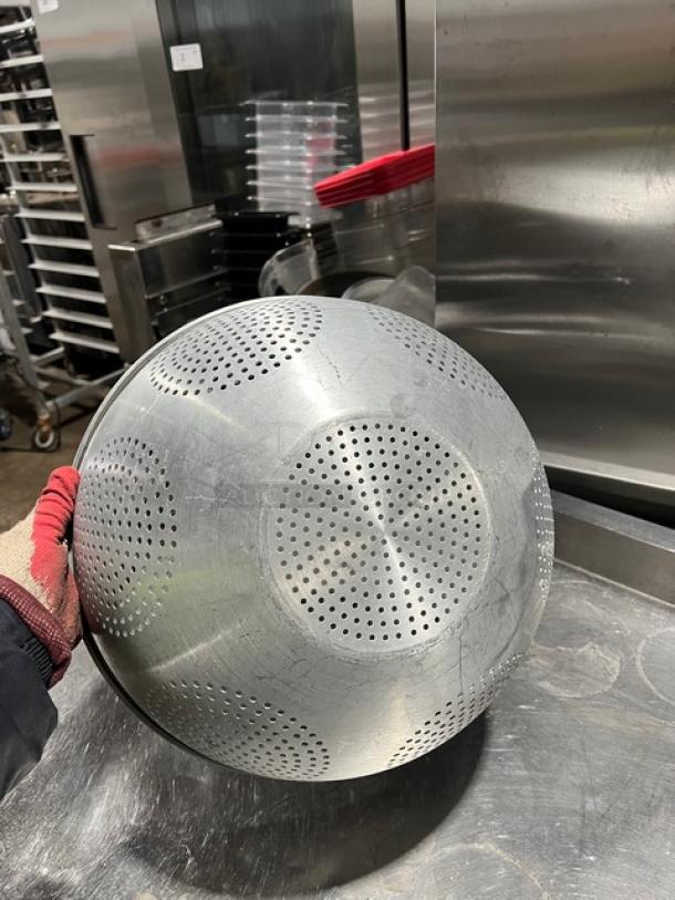 Commercial aluminum Chinese colander with a round geometric pattern and perforations. Used condition. Ideal for straining.