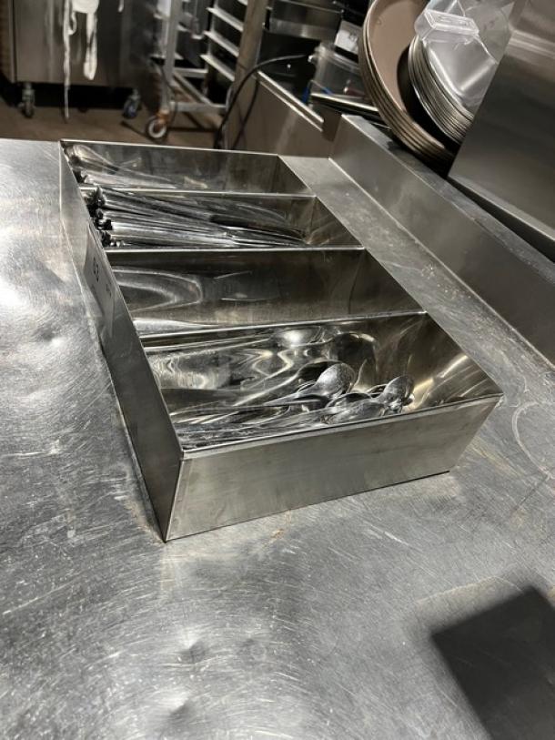 Lot of commercial knives and spoons with 4-compartment stainless steel organizer. Ideal for kitchen use.