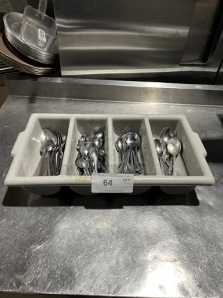 Lot of miscellaneous commercial spoons in a 4-compartment utensil organizer, used condition. Auction tag reads "64 QTY."