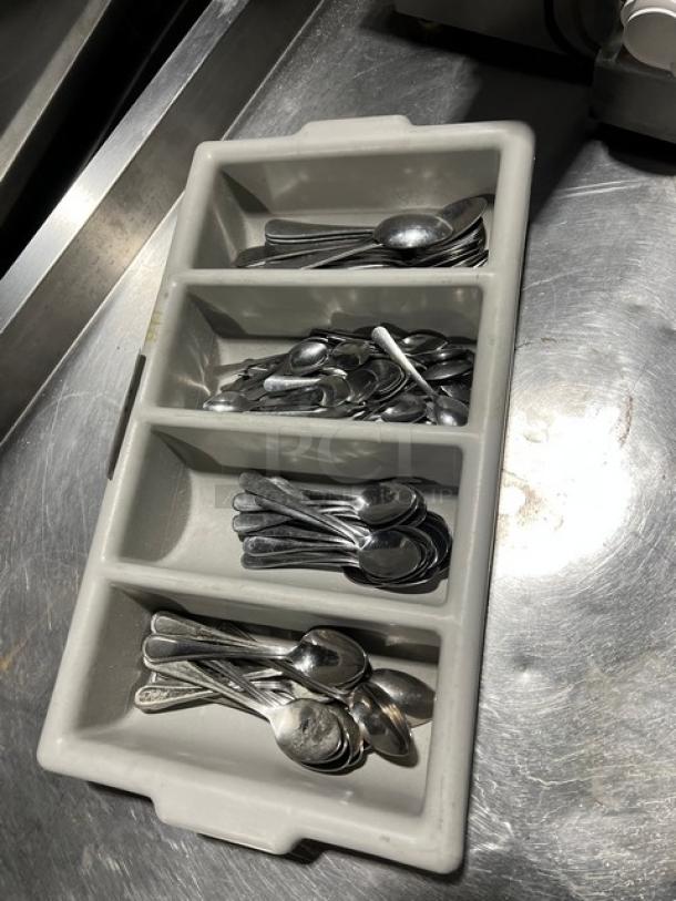 Lot of miscellaneous spoons in a 4-compartment utensil organizer. Good condition, suitable for commercial use.