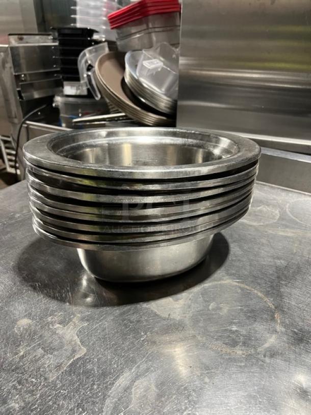Commercial stainless steel oval food pan stack, durable, good condition, ideal for catering or restaurant use.