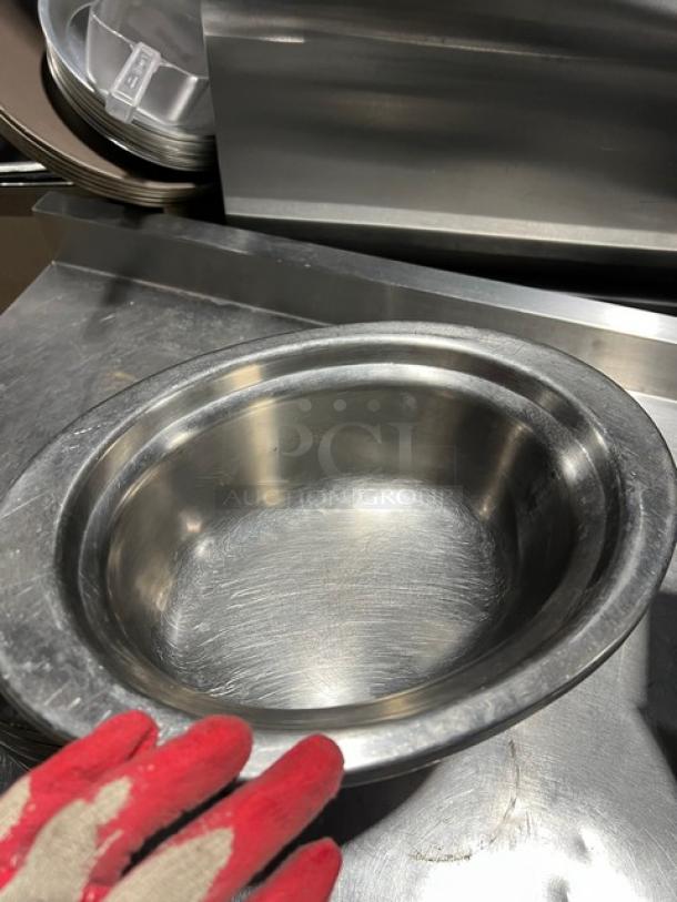 Commercial stainless steel oval food pan in good condition, 8x8 inches. Durable, heavy-duty design for catering use.