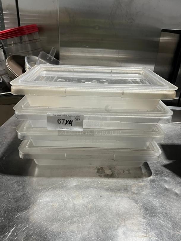 Carlisle StorPlus 2-Gal clear polycarbonate food storage containers with lids, stacked; labels indicate model and auction details.