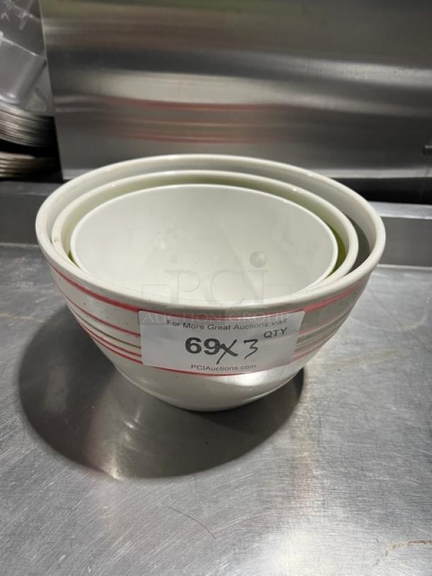 Commercial round assorted bowls, nested set of three. White with red stripes. Good condition. Tag indicates "69X" quantity.