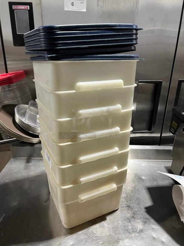 Cambro commercial square food storage containers with navy-blue lids. Stack of six. Durable plastic, used condition.