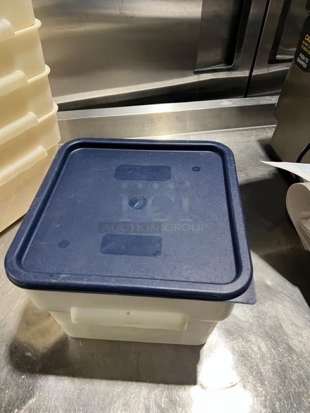 Cambro commercial square food storage container with navy-blue lid, used condition, durable plastic, stackable design.