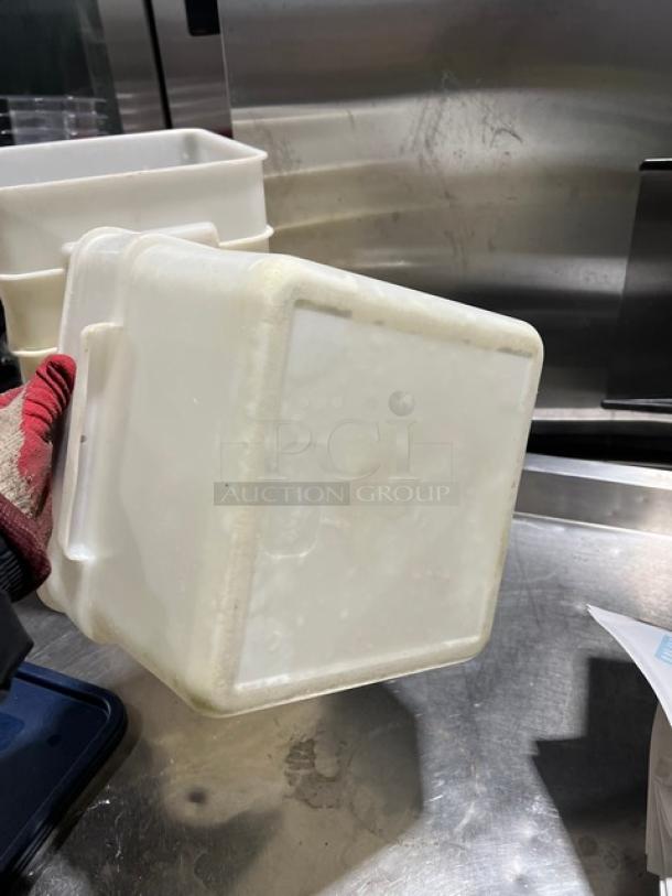 Cambro commercial square food storage container with navy-blue lid, white plastic, durable construction, minimal wear.