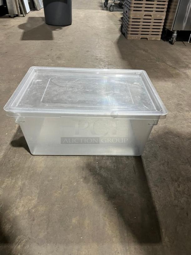 Commercial rectangular food storage container with lid, clear plastic, used condition. Ideal for bulk storage.