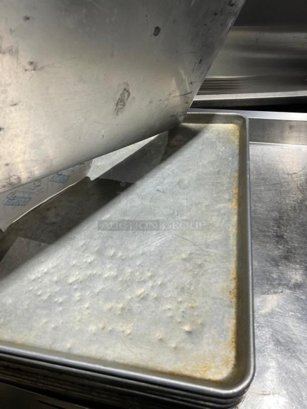 Commercial stainless steel full-size sheet pan, lightly used with visible wear. Includes label reading "5X Your Bid!"