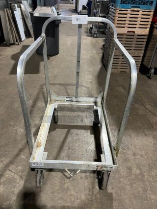 New Age Industries heavy-duty sheet pan dolly, commercial-grade, on casters, metal frame, used condition.