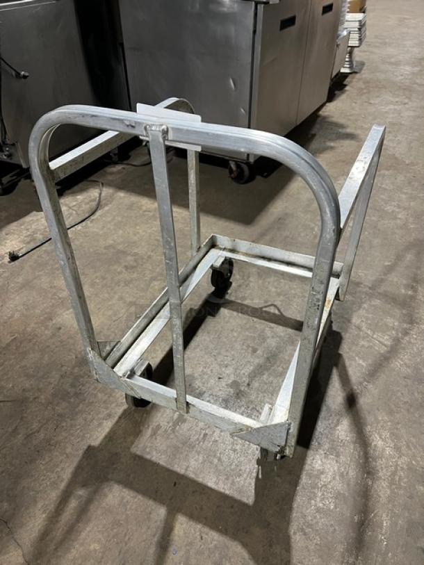 New Age Industries heavy-duty sheet pan dolly with sturdy metal frame and casters, excellent condition.
