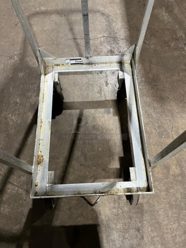 New Age Industries commercial sheet pan dolly on casters. Heavy-duty metal frame, signs of light rust, and wear.