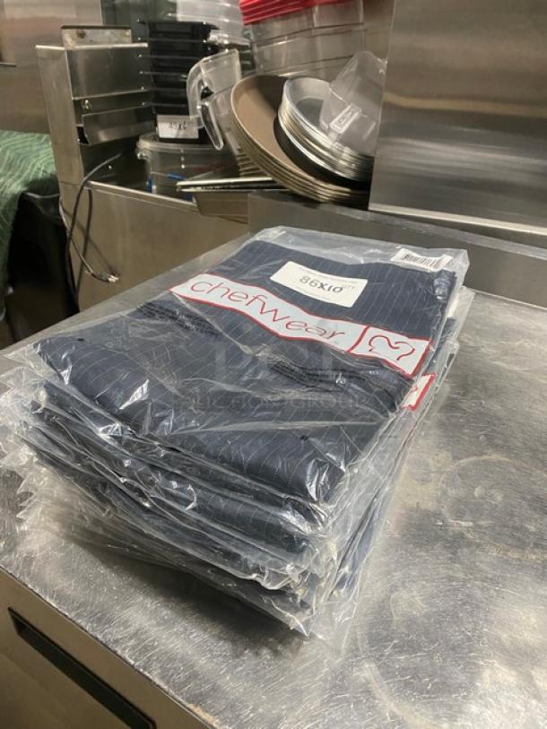 New Chefwear Commercial black chef pants, model CW1620-CW50, in sealed packaging, one size fits all.