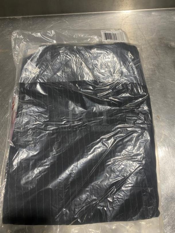 New Chefwear black medium chef pants, model CW3100-CW50, in original packaging.