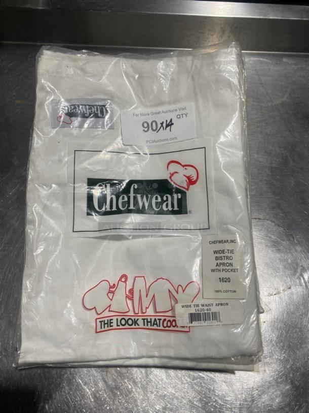 NEW Chefwear white cotton bistro apron, model 1620-40, in packaging. Features wide-tie, pocket. Mint condition.