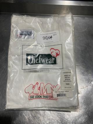 NEW Chefwear white cotton bistro apron, model 1620-40, in packaging. Features wide-tie, pocket. Mint condition.