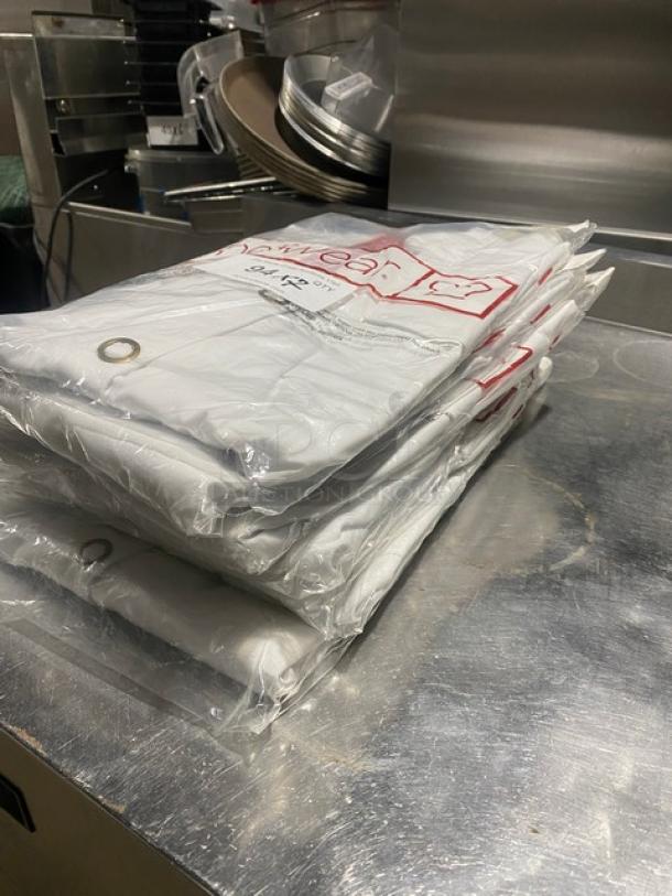 New Chefwear Commercial White Women’s XL Chef Jacket, Model CW5668CW40, in packaging with ring snap button feature.