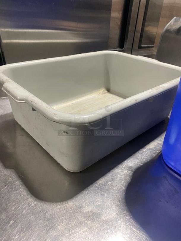 Commercial utility bucket/bus box, grey, rectangular, used condition, handles on sides, suitable for waste management.