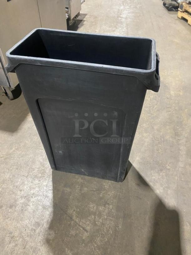 Rubbermaid Slim Jim 23 Gal. Commercial Black Trash Can, rectangular shape, durable plastic, good condition.