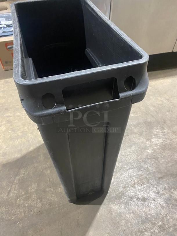 Rubbermaid Slim Jim Series 23 Gal. black rectangular trash can, commercial grade, minor wear, sturdy plastic construction.