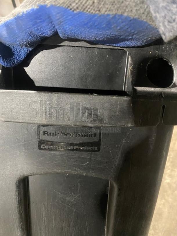 Rubbermaid Slim Jim 23 Gal. black trash can, rectangular, visible branding, commercial use, good condition.