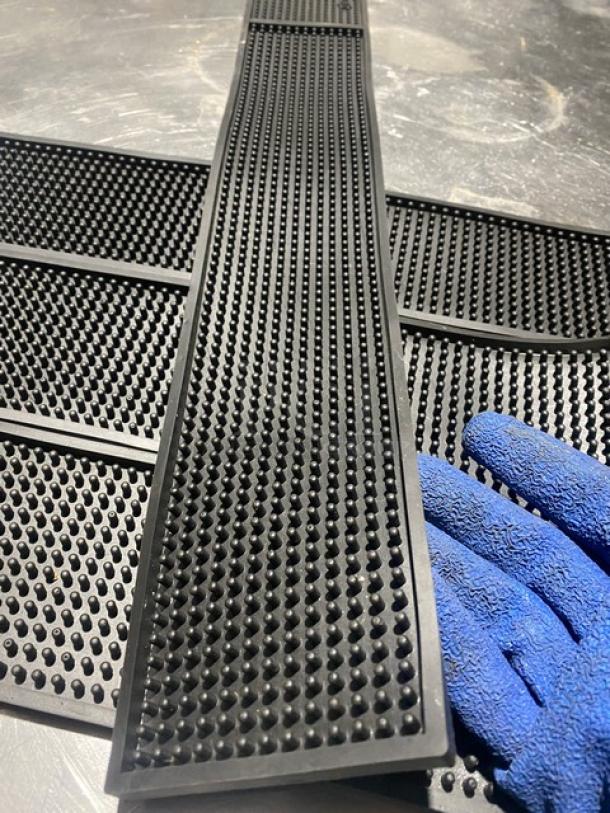 Cocktailor black non-slip bar mat, commercial-grade, durable rubber with textured surface. Includes four mats in excellent condition.