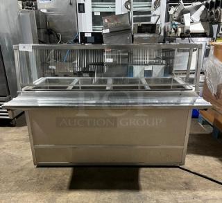 Atlas Metal custom stainless steel 4-well steamtable with sneeze guard, tray slide, enclosed cabinet. Model WIHDM4, on casters.