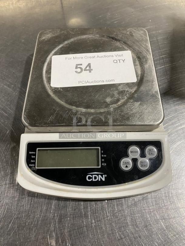 CDN 22 lb digital weight scale, model SD2206, with LCD display and control buttons, showing wear, includes auction label.