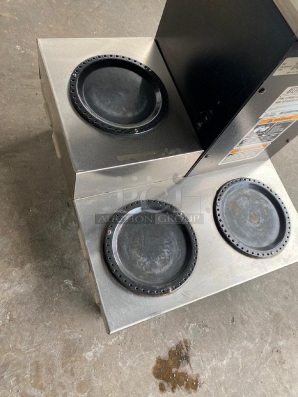 Bunn CW Series coffee brewer, stainless steel, 4 warmer plates, model CWTF35, electric, with hot water dispenser and brew basket.