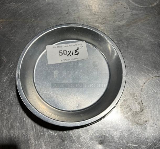 Commercial aluminum round pie pan, visibly labeled "50X5 QTY," in good condition on a metal surface.