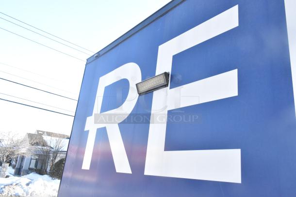 Southern Dimensions mobile kitchen trailer, blue exterior, partial "RE" lettering. Ready for customization with equipment.