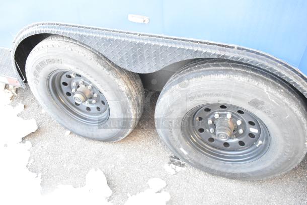 Southern Dimensions food trailer wheels, dual axle, sturdy frame, well-maintained tires; trailer ready for outfitting.