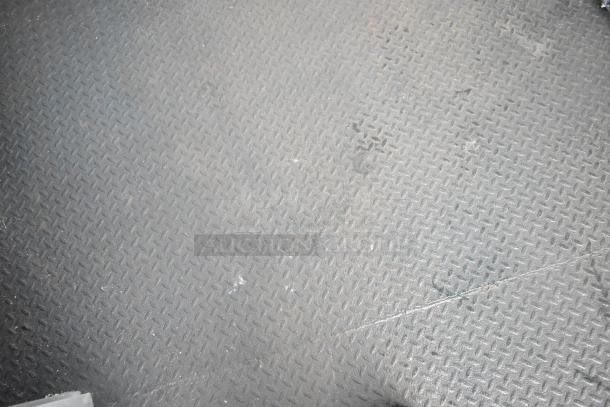 Non-slip metal flooring inside a Southern Dimensions food trailer.