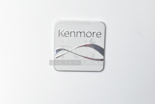 Kenmore logo on white surface, indicative of the chest freezer included in the Southern Dimensions food trailer.