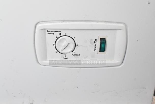 Close-up of the Kenmore chest freezer control panel in the Southern Dimensions food trailer, showing settings dial and power switch.