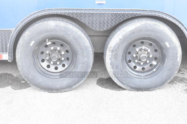 Dual wheel setup on Southern Dimensions Shell Food Trailer, black rims, visible tire branding "Sailun," clear condition.