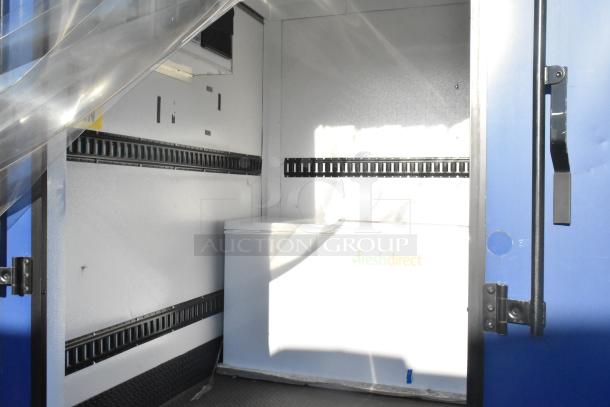 Southern Dimensions Shell Food Trailer interior with Kenmore chest freezer and insulation panels. Ready for equipment.