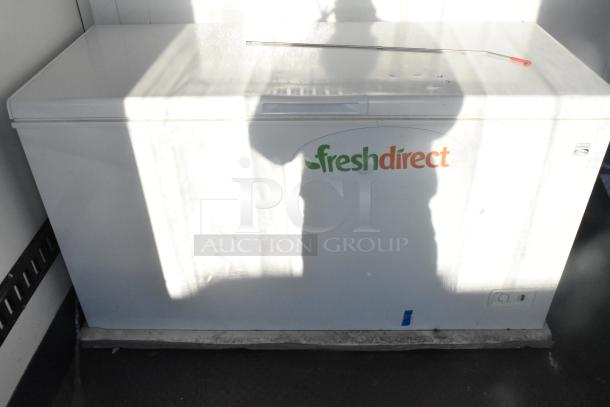 Southern Dimensions Shell Food Trailer interior with Kenmore chest freezer featuring "freshdirect" logo; ready for outfitting.